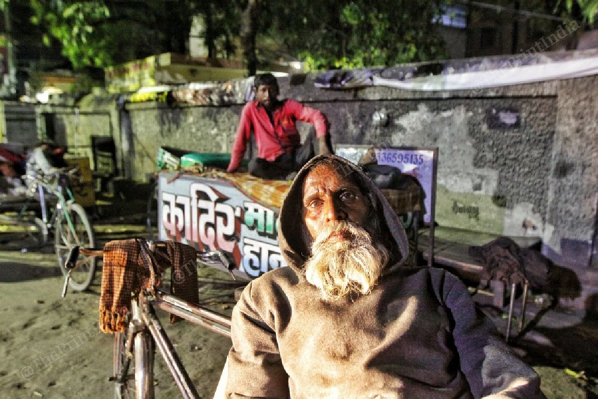 Hiralal (in front) a rag picker from Luknow and Mohammad Rahman a rickshaw puller in red shirt from Hardoi at Kesar Bagh | Photo: Praveen Jain | ThePrint