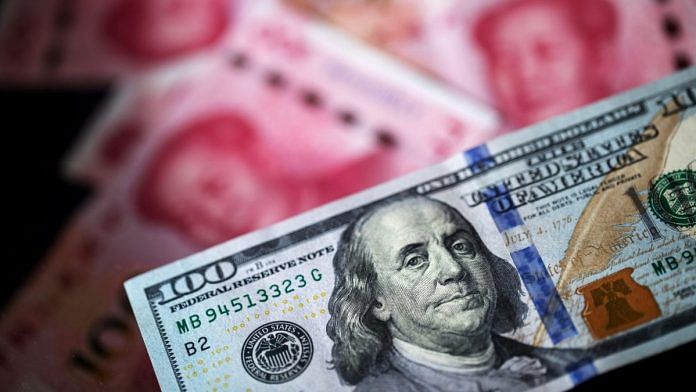 Representational image | A US one-hundred dollar banknote and Chinese one-hundred yuan banknotes | Paul Yeung/Bloomberg