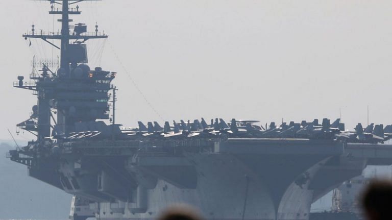 Captain of virus-hit US aircraft carrier relieved of command after his plea for evacuation