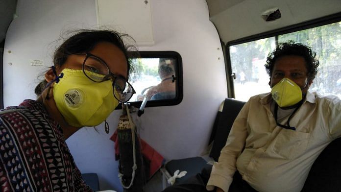 ThePrint's journalists Simrin Sirur (left) and Praveen Jain in an ambulance, commuting to their quarantine centre in Vadodara | Photo: Simrin Sirur | ThePrint