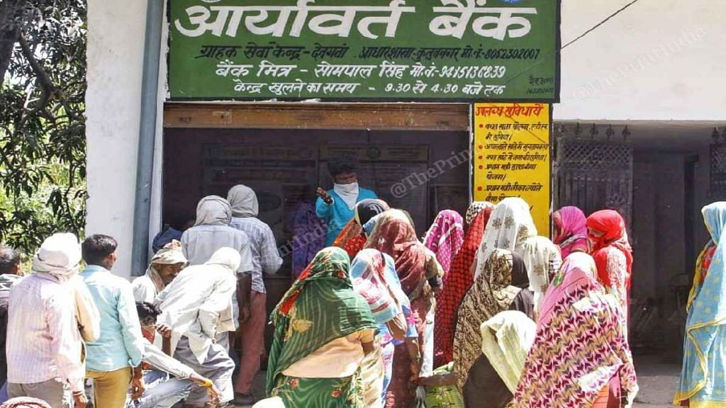Residents of Piswan in Sitapur, UP, lined up outside Aryavart Bank Monday
