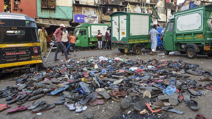 Mumbai: Footwear of protestors lying on the road after police action on migrant workers who assembled at Bandra Railway Station, Tuesday | PTI