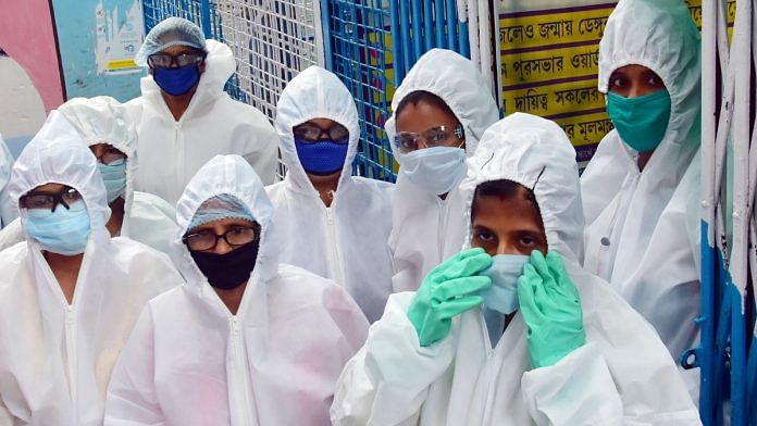 Women health workers during house-to-house drive for coronavirus at a slum in Kolkata on 27 April 2020