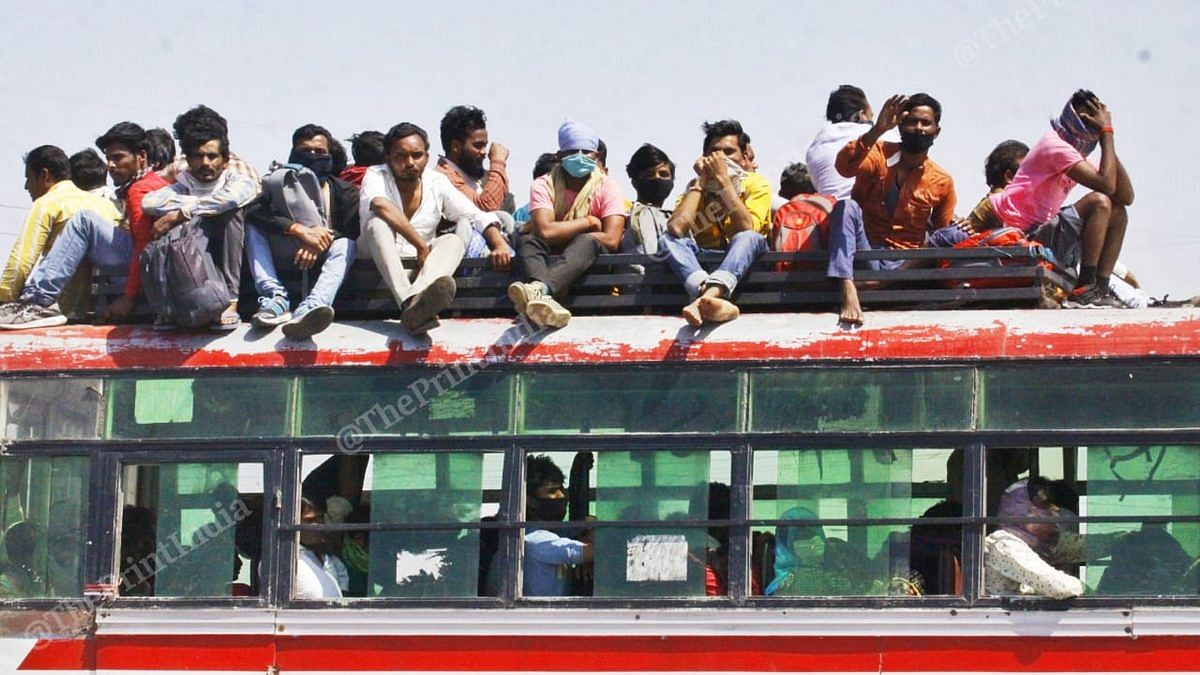 Migrant workers sit on top of a bus in Uttar Pradesh | Photo: Praveen Jain | ThePrint