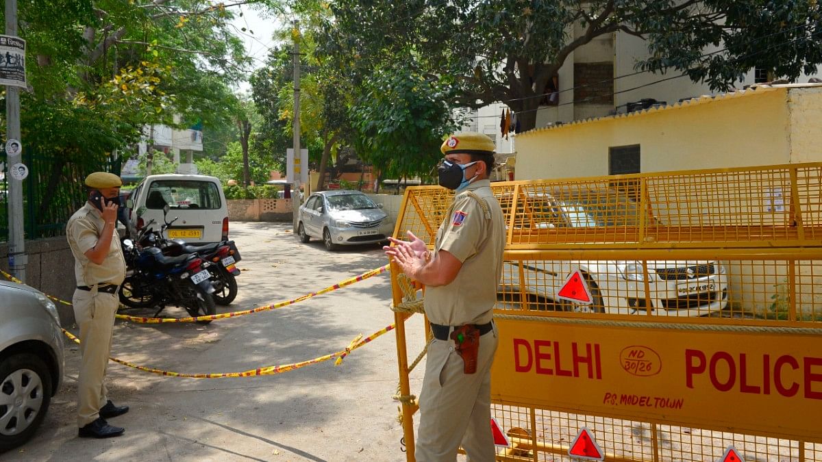 Delhi Police personnel stand guard at Model Town police colony, identified as a Covid-19 hotspot, during the on 16 April 2020 | Kamal Kishore | PTI