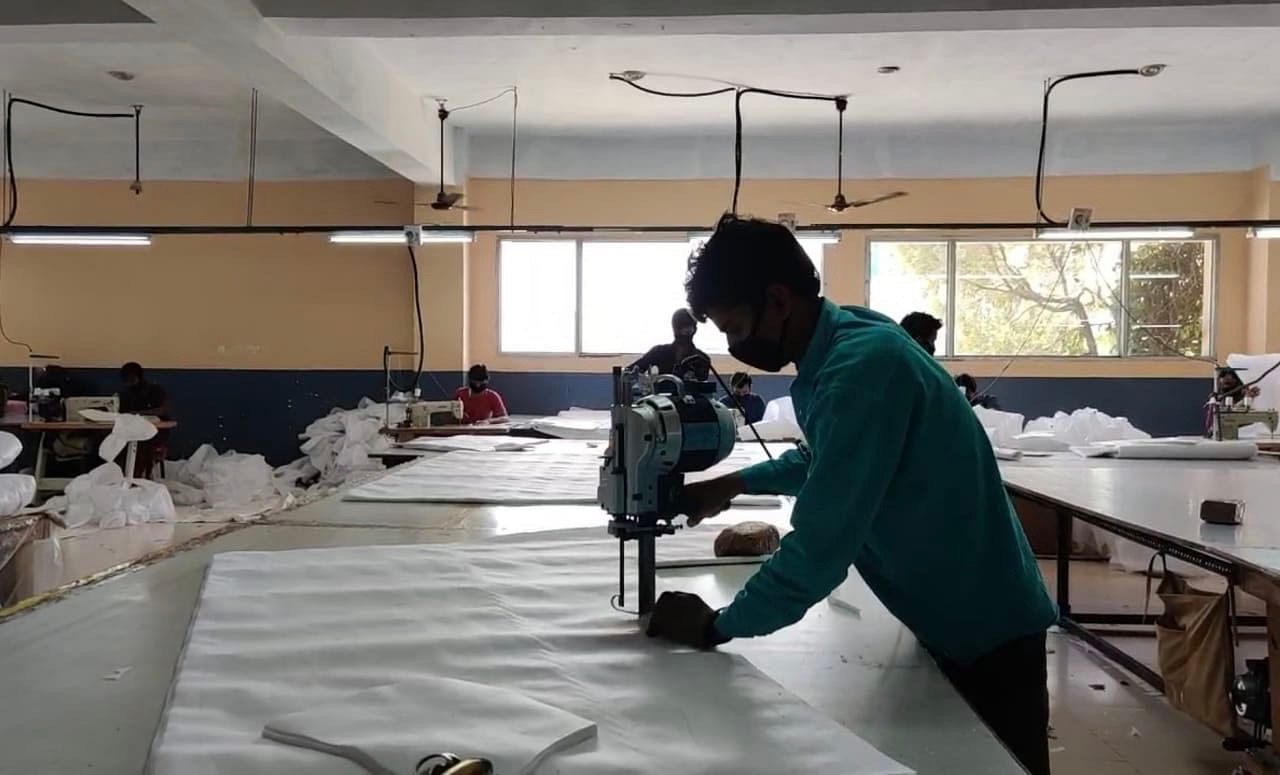 A tailor cutting fabric for PPE suits | Photo: Urjita Bhardwaj | ThePrint