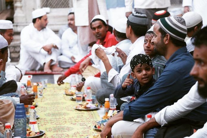 People sit for a community meal during Ramzan | Manisha Mondal | ThePrint File Photo