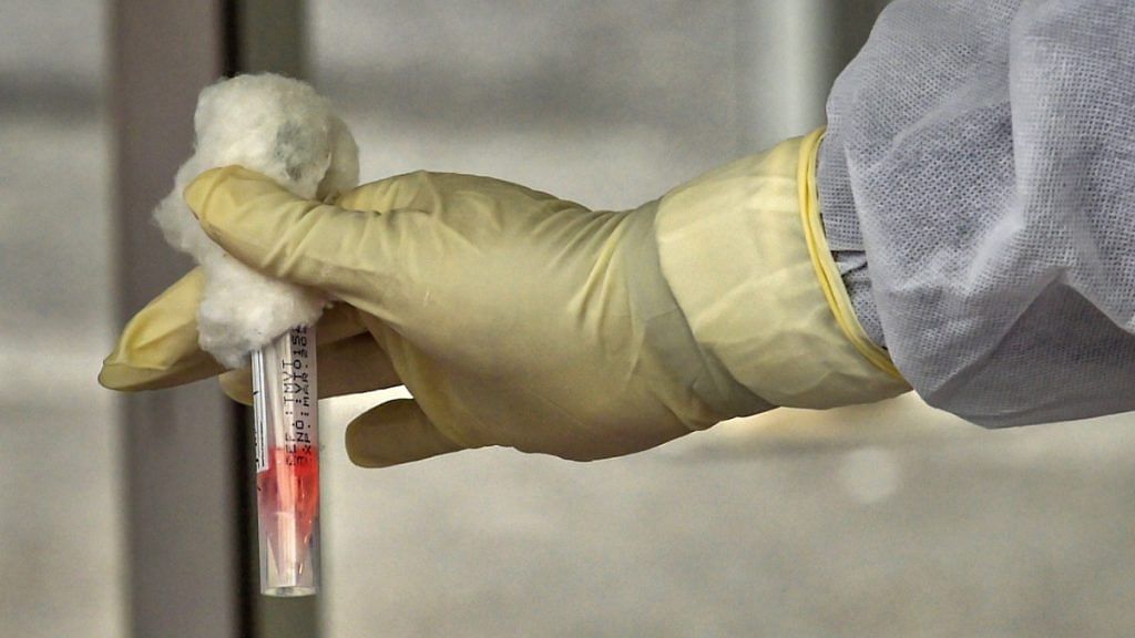 A medic works on Covid-19 samples (representational image) | Photo: PTI