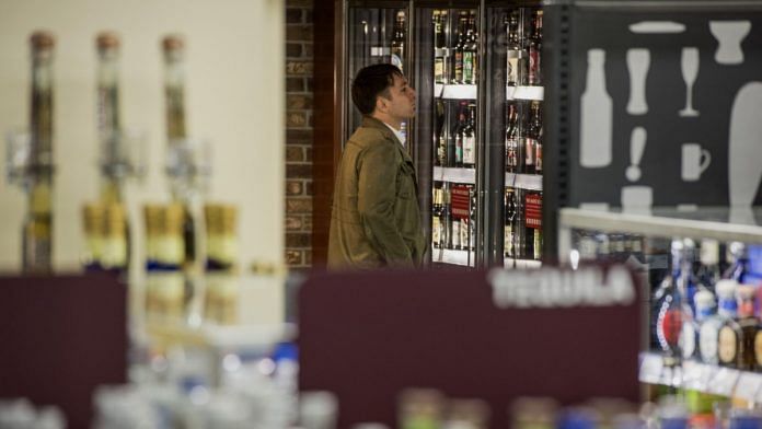 A file photo of a customer shopping for alcoholic beverages at a store in San Francisco, California | David Paul Morris | Bloomberg