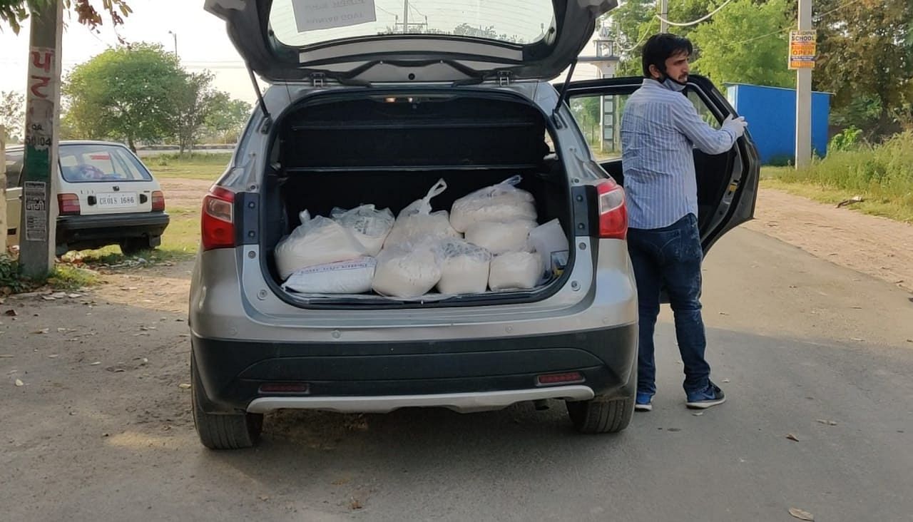Jawaharpur panchayat secretary Jatinder Singh brings essentials to the village in his car | Screengrab