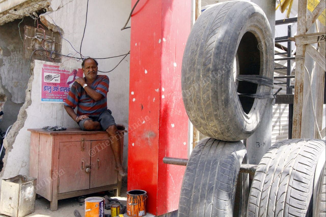 Moti Lal Khatik at his tyre repair shop. Photo: Praveen Jain | ThePrint