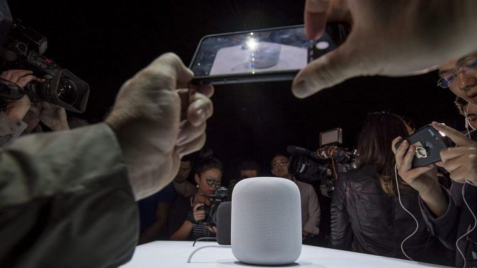 Attendees take photographs of the Apple Inc. HomePod speakers | Bloomberg