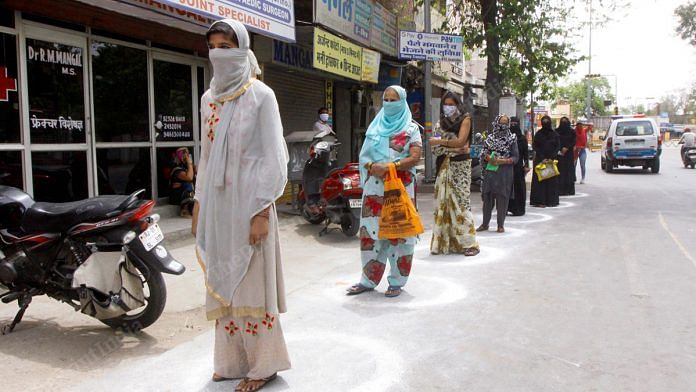 Women queue up outside a Bank of Baroda branch in Ajmer as they wait to withdraw cash from their accounts | Photo: Praveen Jain | ThePrint