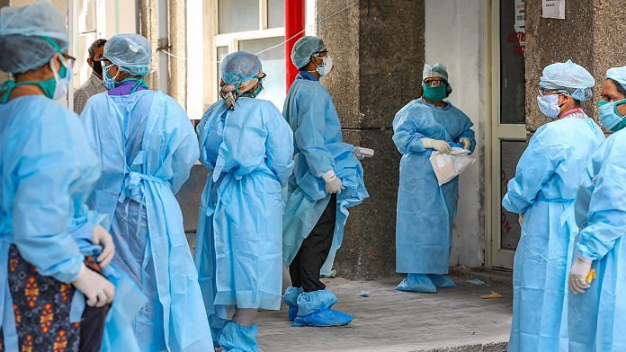 Paramedical staff at Akhnoor Hospital in protective gear outside an isolation ward in Jammu (representational image) | PTI