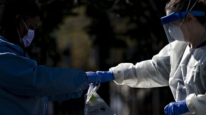 A Children's National Hospital healthcare worker places a vial into a Quest Diagnostics bag at a drive-thru coronavirus testing site at Trinity Washington University in Washington, D.C., U.S. (Representational Image) | Photographer: Andrew Harrer | Bloomberg