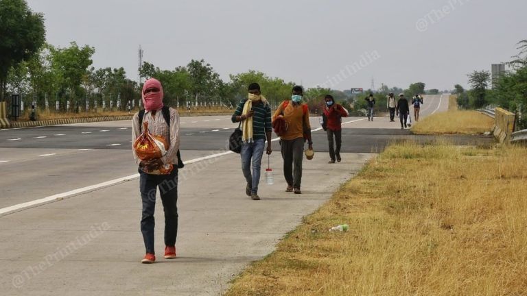 With just biscuits and water, migrants on highways walk, cycle to homes hundreds of miles away