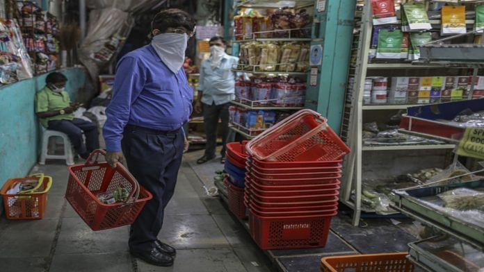 A man shopping with his face covered | Dhiraj Singh | Bloomberg