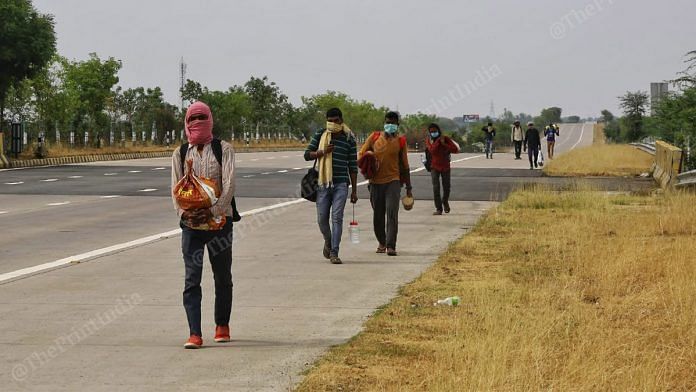 File photo | A group of migrant workers headed to Uttar Pradesh on foot hoping to cover 700 km and meet family members, April 2020 | Photo: Suraj Singh Bisht | ThePrint
