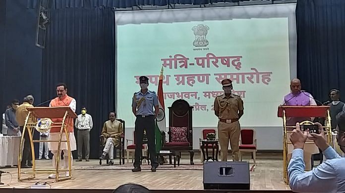 BJP leader Narottam Mishra takes oath at the swearing-in ceremony at Raj Bhavan in Bhopal. | By special arrangement | ThePrint