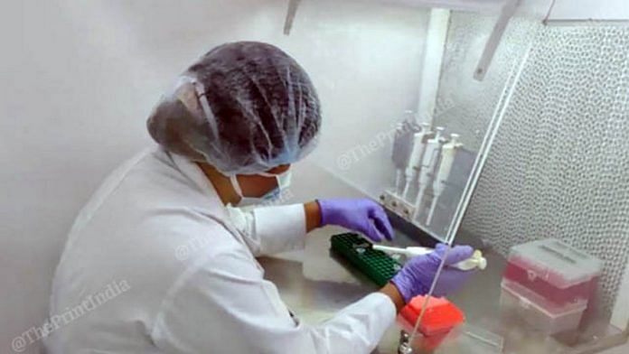 A scientist performing an RT-PCR test | Photo: Angana Chakrabarti | ThePrint