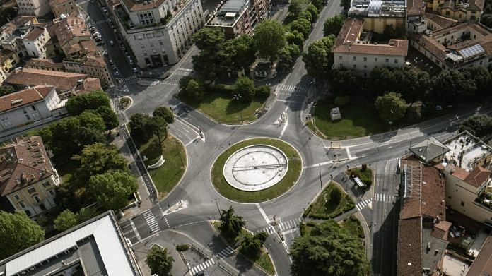 An intersection stands empty in Brescia, Italy on April, 19. | Bloomberg