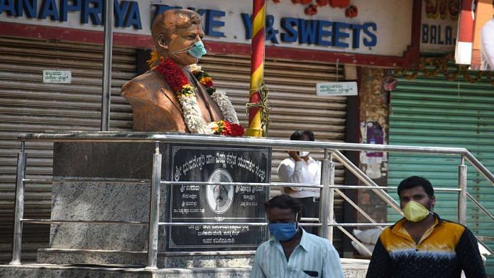 A bust of the late Kannada actor Dr Vishnuvardhan seen with a mask during the Covid-19 lockdown, in Bengaluru Wednesday