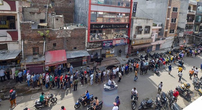 People in queues for buying alcohol as liquor shops reopen in Delhi. Photo | PTI