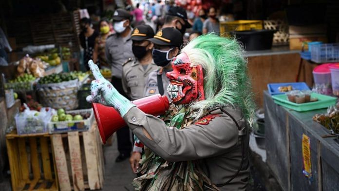 A police officer wears a mask called 