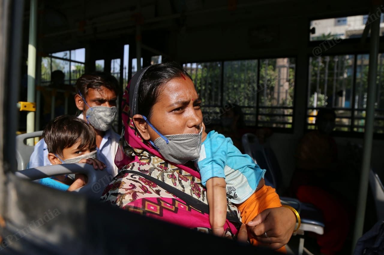 Migrant workers and families arrive at the New Delhi railway station in buses | Photo: Manisha Mondal | ThePrint