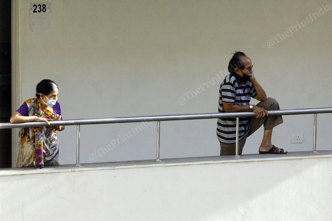 Those left at the centre look on, waiting for their turn to leave | Photo: Praveen Jain | ThePrint