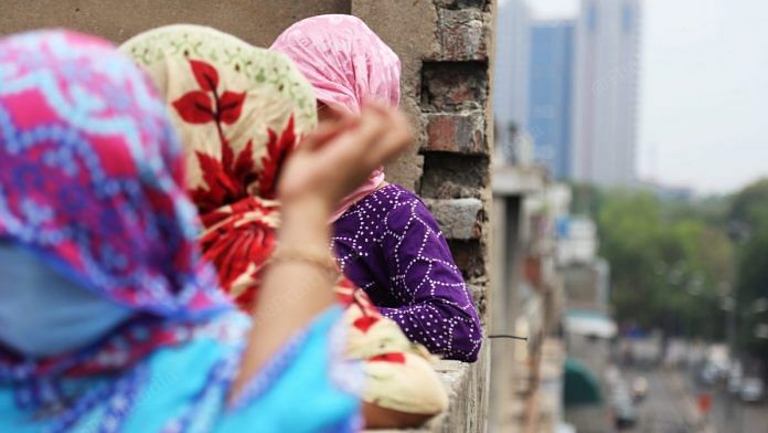 Women stand on the terrace of a brothel on G.B. Road | Manisha Mondal | ThePrint