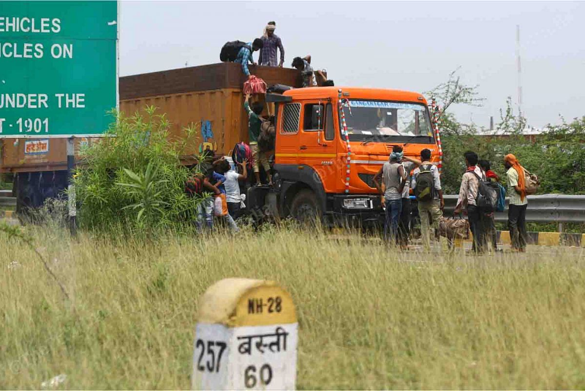 Migrant workers disembark from a truck in Basti, Uttar Pradesh | Suraj Singh Bisht | ThePrint