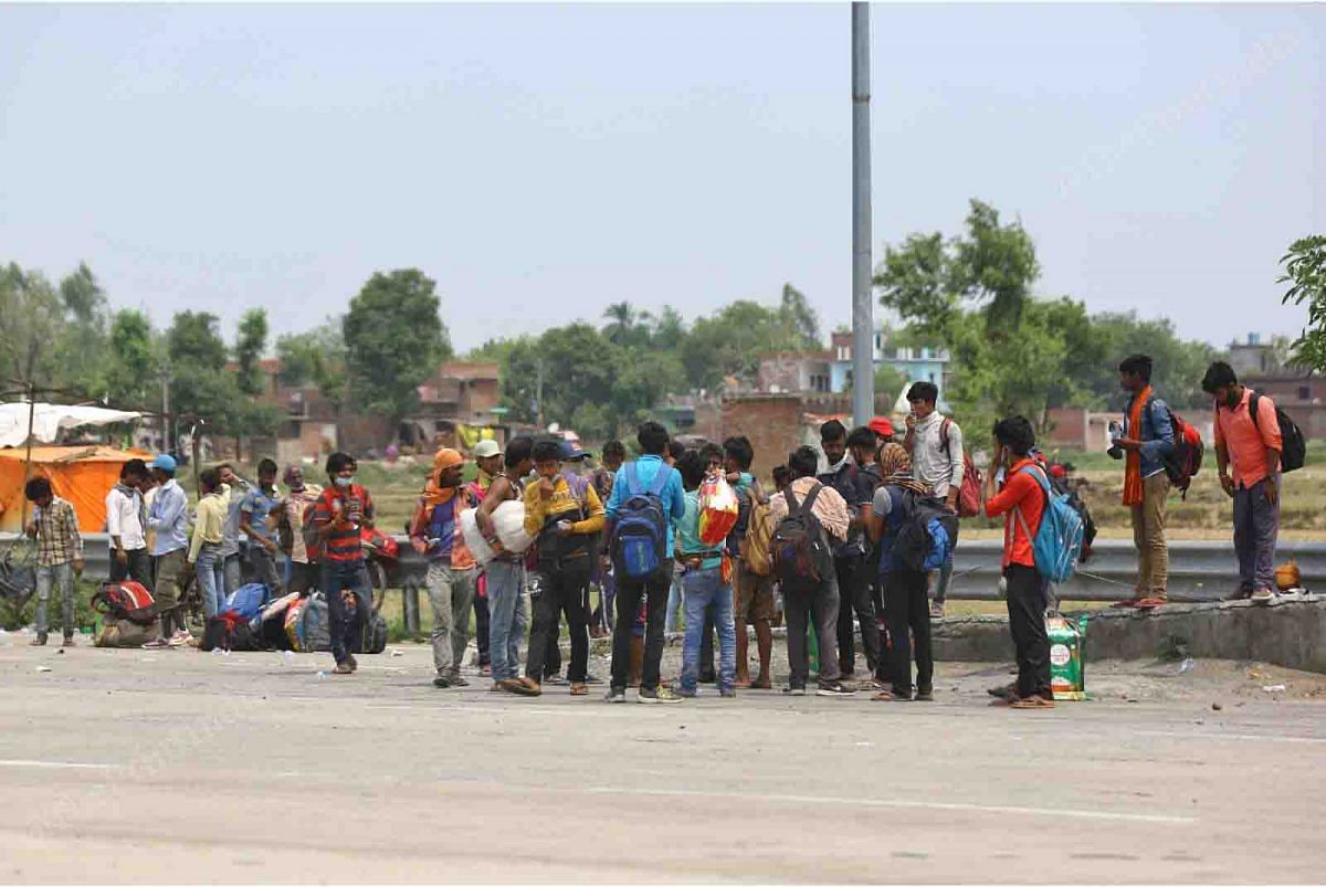 Workers take a short break on the NH-28 in Uttar Pradesh. People have continued walking the hundreds of kilometres to their villages despite the scorching heat | Suraj Singh Bisht | ThePrint