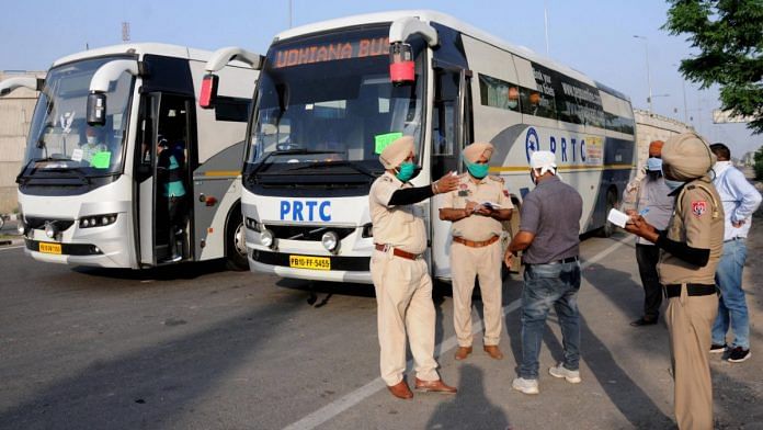 Police personnel note down details of passengers travelling from Nanded, who will be subjected to a mandatory 21-day quarantine in the wake of coronavirus pandemic, in Amritsar | PTI