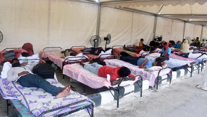 Passengers taking rest at a makeshift tent prepared by the district administration at Guwahati Railway Station on 20 May 2020