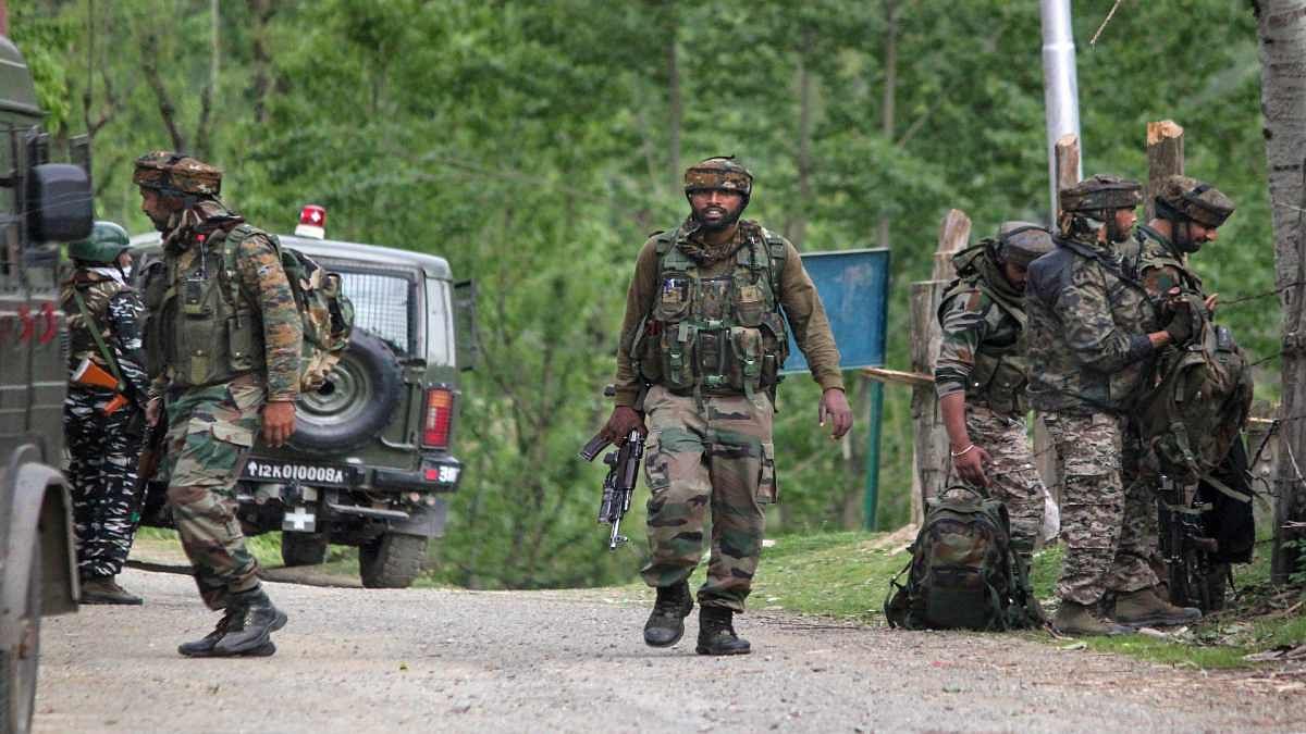 Security forces at the site of an encounter last week that killed five personnel, including two Army officers, in Kashmir's Handwara | PTI