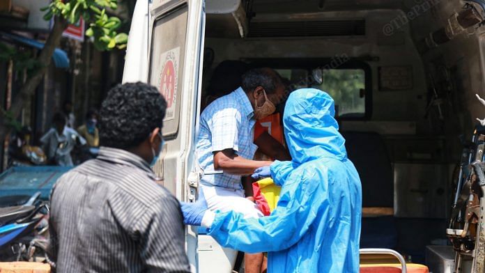 Healthcare workers in PPE suits escort Covid patients in Royapuram, Chennai | Manisha Mondal | ThePrint