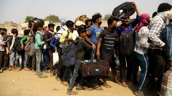 Migrant workers jostling to board buses at Ghaziabad's Ramlila Maidan Monday | Photo: Suraj Singh Bisht | ThePrint