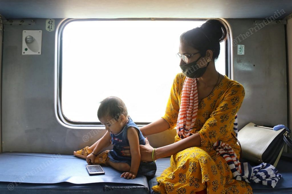 A woman travelling with her baby on a special train from New Delhi to Secunderabad | Photo: Suraj Singh Bisht