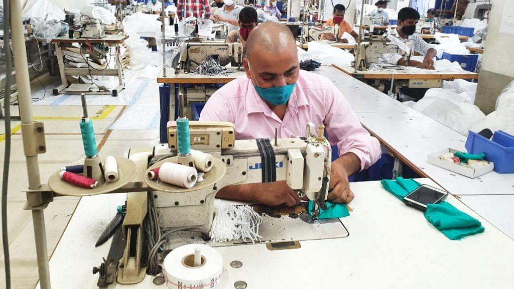 There are 30 men to stitch the cloth | Photo: Soniya Agarwal | ThePrint