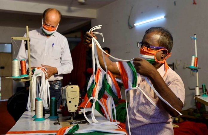 A worker stitches Tricolour masks at a Delhi factory on 8 May | Representational image | PTI