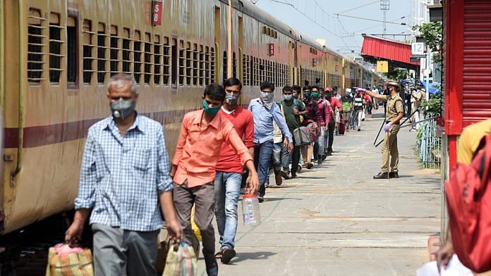 Migrants from Tamil Nadu at Danapur station board a train to reach their destination, in Patna on 11 May 2020