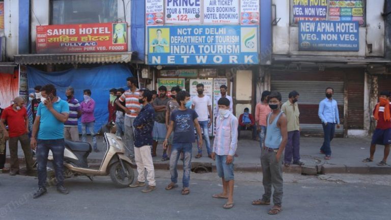 No internet or debit card, migrants gather at New Delhi station in hope of booking tickets