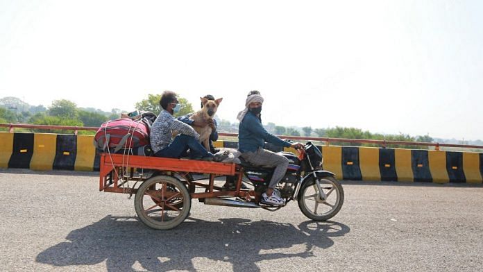 Santosh Kumar and his family, along with Mr Tommy, on their way home to Bundelkhand | Manisha Mondal | ThePrint