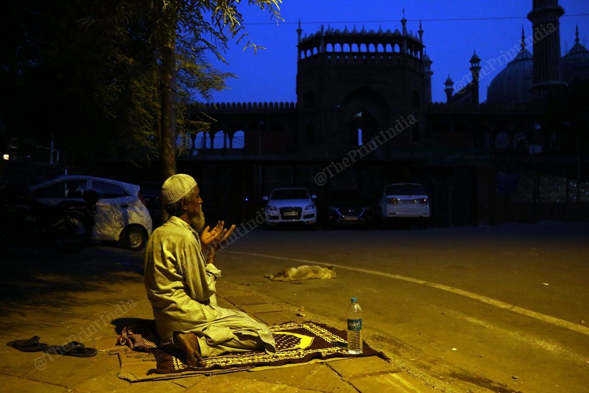 A man offers namaz on the empty roads near Jama Masjid | Photo: Suraj Singh Bisht | ThePrint