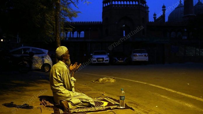 A man offers namaz on the empty roads near Jama Masjid | Photo: Suraj Singh Bisht | ThePrint