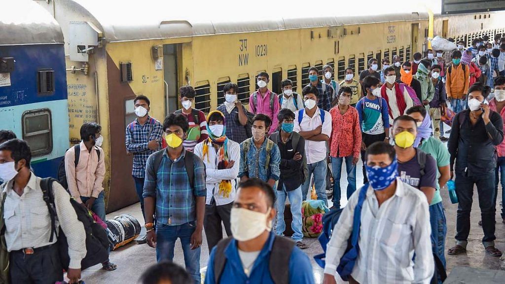 Migrants from Jaipur arrive by Shramik Special train at Danapur junction, during the nationwide lockdown to curb the spread of coronavirus