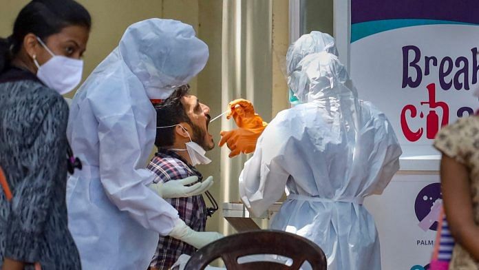 Medics collect swab sample of a man for Covid-19 testing in Kozhikode (representational image) | PTI