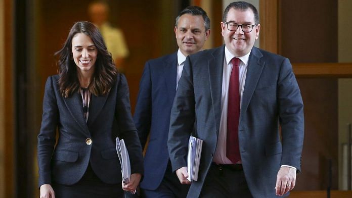 New Zealand PM Jacinda Ardern, MP Grant Robertson and Green Party leader James Shaw walk to the house for the presentation of the budget at Parliament in Wellington | Bloomberg