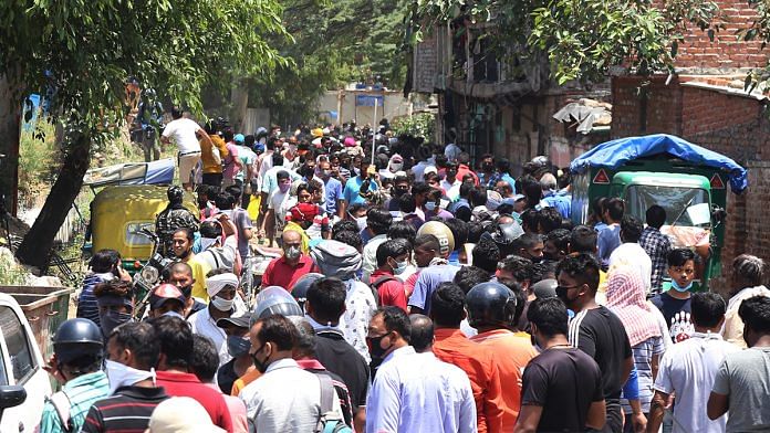 People crowding outside an alcohol shop in Delhi | Photo: Manisha Mondal | ThePrint